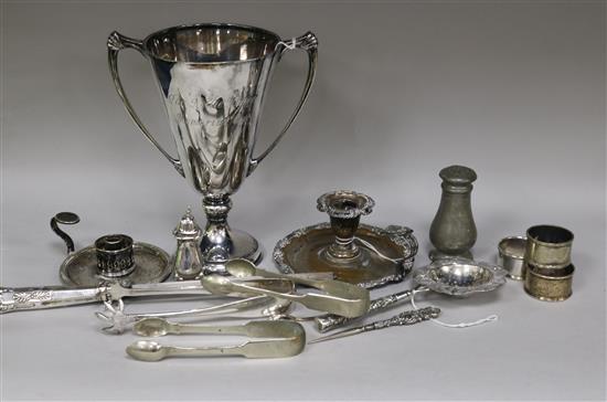 A silver two-handled trophy cup, a white metal strainer and sundry plated items.